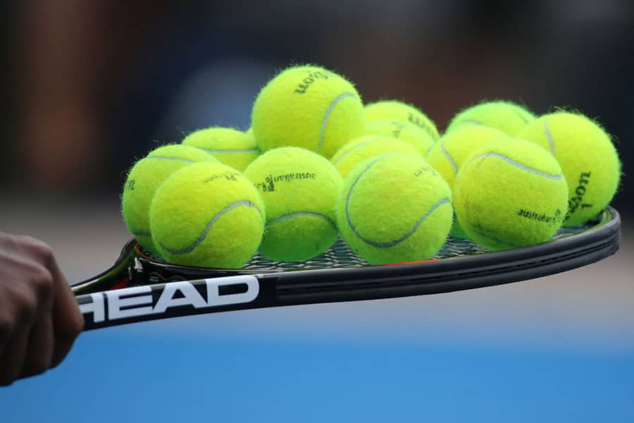 Why are most tennis balls yellow?